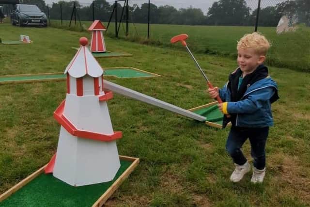 Children playing crazy golf at one of the Mid Sussex District Council Play Days