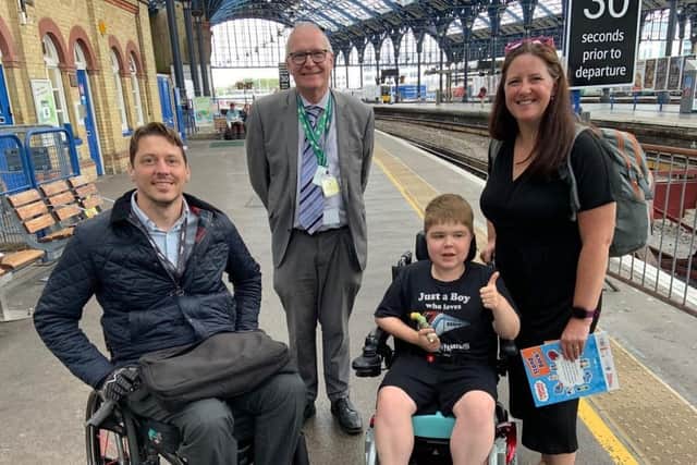 Ryan Horrod, 13, with, from left, GTR accessibility lead Carl Martin, Brighton area station manager Graham Thrower and his mum, Anne