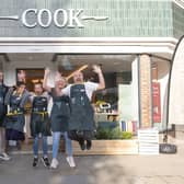 A Horsham food shop has unveiled a new look, with a kitchen island where customers can sample dishes and get help planning their meals. Founded in 1997, COOK is an independent, family-owned company making and selling homemade frozen meals and puddings.