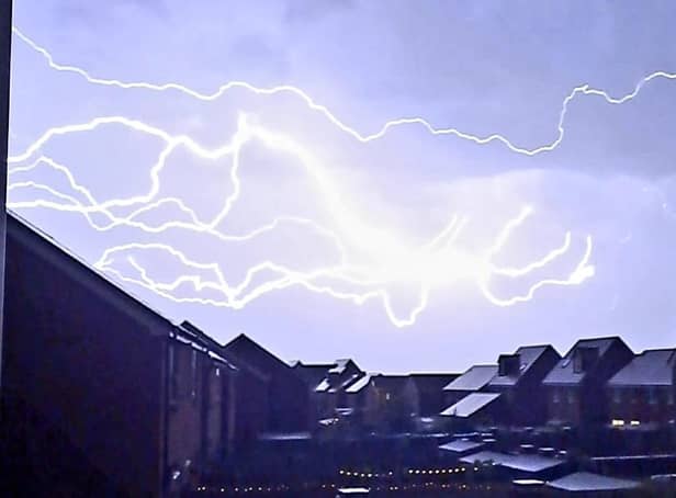 One member of the public captured the moment lightning bolts lit up houses in Worthing