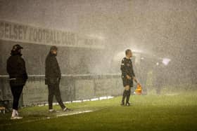 Very heavy rain during the first half of Selsey v Roffey, Manager Daren Pearce and Assistant get a soaking:Selsey v Roffey action in SCFL Division 1