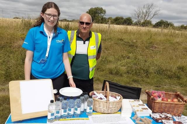 4Sight Vision Support marketing and communications officer Jessica Passmore and volunteer Max serving halfway refreshments