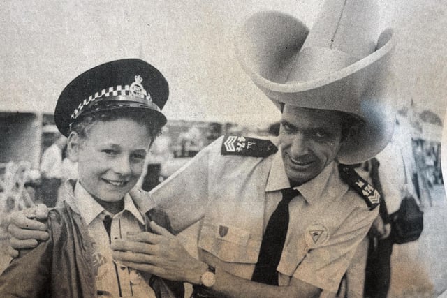 11-year-old Glen Fuller swapped hats with Sgt. Bill McLellan
