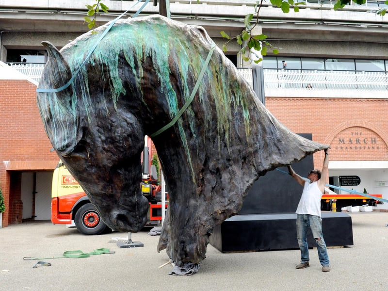 Nic Fiddian Green with his sculpture Fire before it was hoisted into position at Goodwood in July 2012