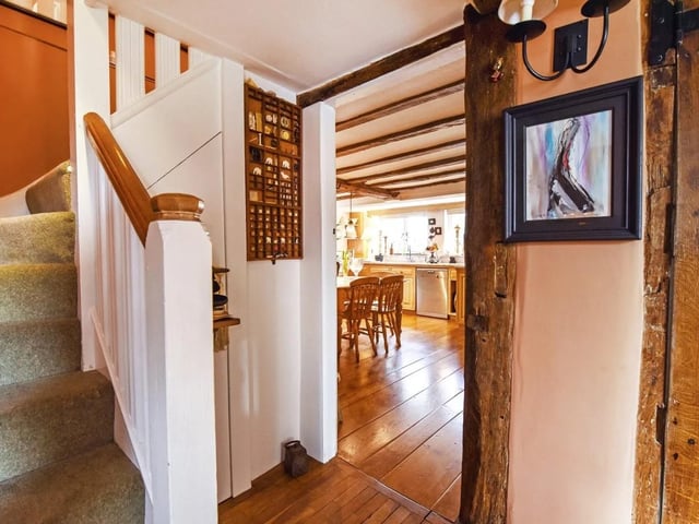 The entrance hall has exposed beams