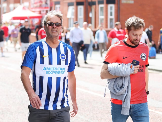 MANCHESTER, ENGLAND - AUGUST 07: Brighton & Hove Albion fans arrive at the stadium prior to the Premier League match between Manchester United and Brighton & Hove Albion at Old Trafford on August 07, 2022 in Manchester, England. (Photo by Catherine Ivill/Getty Images)