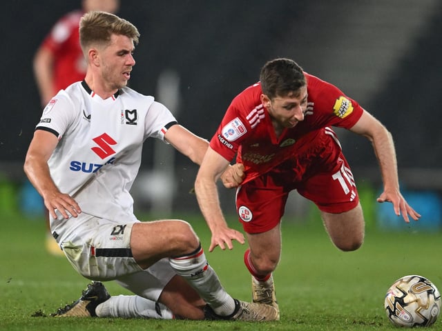 Milton Keynes Dons defender Jack Tucker (4) fouls Crawley Town midfielder Jack Roles (11) during the EFL Sky Bet League 2 play-off second leg match between Milton Keynes Dons and Crawley Town at stadium:mk, Milton Keynes, England on 11 May 2024.:Crawley Town hammered MK Dons 5-1 - and 8-1 on aggregate - to reach the League Two play-off final Wembley. Photographer Dennis Goodwin/Pro Sport Images was there to catch the action, the crowd and the celebrations