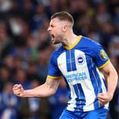 Adam Webster of Brighton & Hove Albion celebrates scoring the team's sixth penalty in the penalty shoot out during the Emirates FA Cup Semi Final against Manchester United at Wembley last April (Photo by Clive Rose/Getty Images)