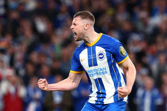 Adam Webster of Brighton & Hove Albion celebrates scoring the team's sixth penalty in the penalty shoot out during the Emirates FA Cup Semi Final against Manchester United at Wembley last April (Photo by Clive Rose/Getty Images)
