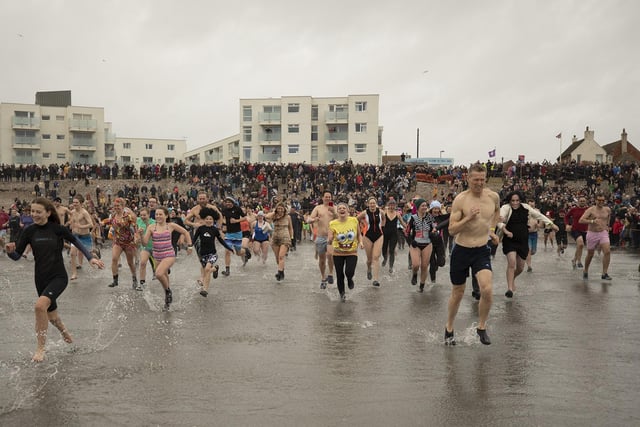 335 people brave the icey sea conditions in the 1st Birdham & Wittering Scout Group New Years Day 'Big Dip' 2023 raising money for scouts beavers young people's activities.