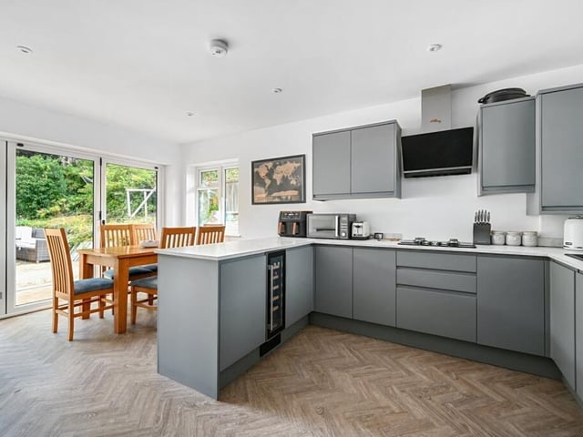 The modern fitted kitchen and dining room