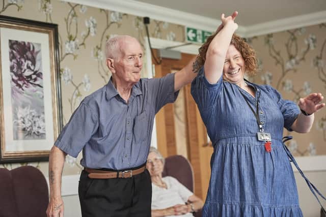 Cyril enjoying a dance with home manager Clare. Picture:  Guild Care