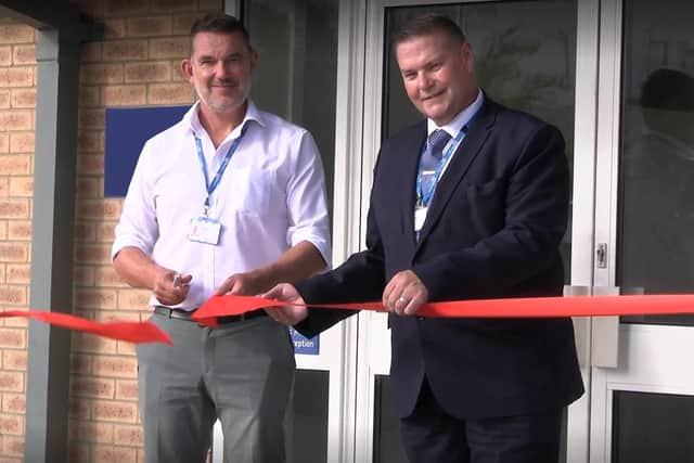 Chief executive, George Findlay, and laundry and transport manager, Richard Knowles, cut the ribbon on the refurbished laundry