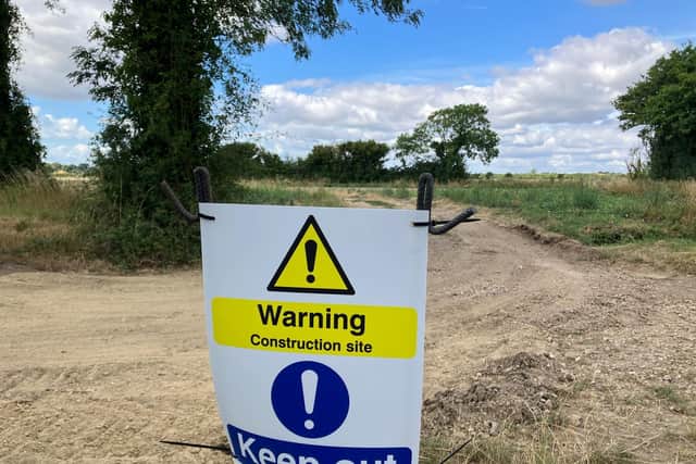 A sign has appeared in a Tangmere field