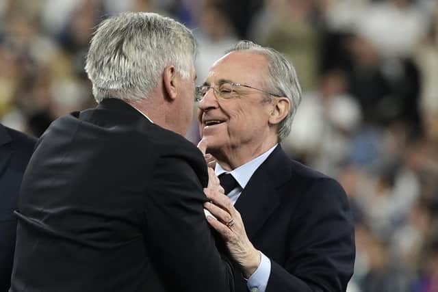 Real Madrid's Italian coach Carlo Ancelotti speaks with club president Florentino Perez  (Photo by JAVIER SORIANO/AFP via Getty Images)