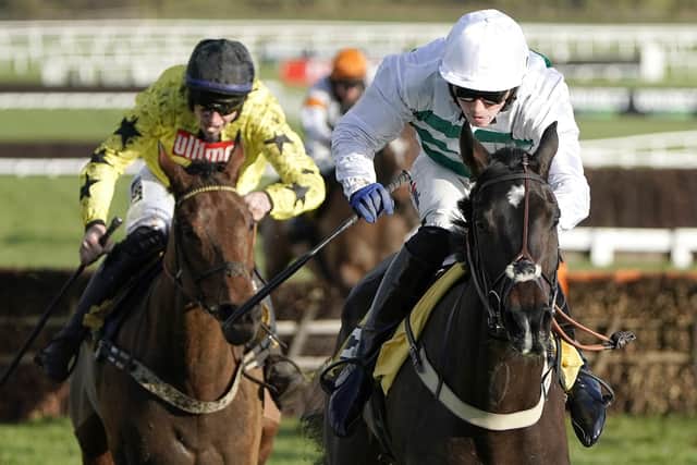Joshua Moore riding Botox Has (white) clear the last to win The JCB Triumph Trial Juvenile Hurdle at Cheltenham in 2019 (Photo by Alan Crowhurst/Getty Images)