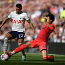 Kaoru Mitoma of Brighton & Hove Albion tackles Pedro Porro of Tottenham Hotspur