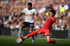 Kaoru Mitoma of Brighton & Hove Albion tackles Pedro Porro of Tottenham Hotspur