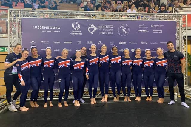 Senior Women's Team. (Isabella Hunt is 3rd from right; Coach Amber SW is behind the gymnasts)