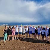 Swimmers set off from Brighton beach in Sussex. Journalists swam in solidarity at 10 Brighton beaches around the world to mark one year since reporter Evan Gershkovich was imprisoned in Russia