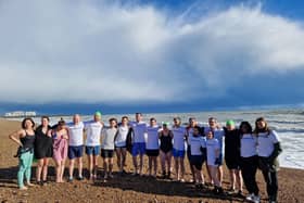 Swimmers set off from Brighton beach in Sussex. Journalists swam in solidarity at 10 Brighton beaches around the world to mark one year since reporter Evan Gershkovich was imprisoned in Russia