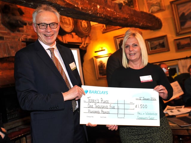 Judge Gary Shipton presents a cheque for £1,500 to Terry's Place