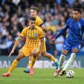 Levi Colwill, of Chelsea, challenged by Yasin Ayari and Ferdi Kadıoglu of Brighton & Hove Albion during a Premier League match on September 28, 2024. (Photo by Mike Hewitt/Getty Images)