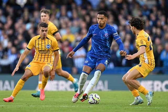 Levi Colwill, of Chelsea, challenged by Yasin Ayari and Ferdi Kadıoglu of Brighton & Hove Albion during a Premier League match on September 28, 2024. (Photo by Mike Hewitt/Getty Images)