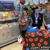 Community champion Alison Whitburn, right, with volunteer Joe and a colleague at the Poppy Appeal collection table in Morrisons Littlehampton