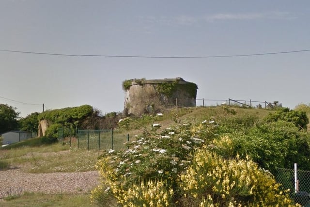 Martello tower built 1806. Situated on the edge of a caravan park. The preservation of archaeological and historical significance will be the main consideration in assessing the suitability of proposals to convert Martello towers for residential use. Historic England is working with the owner of the site to try and achieve a sustainable solution to the long-term conservation of the Martello.