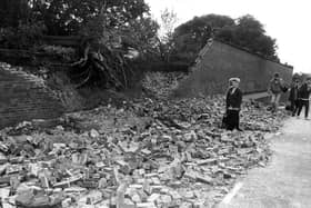 The 15ft-high wall to the Bishop's Garden in Chichester was demolished by an uprooted tree