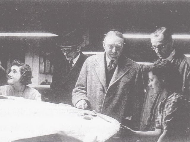 Oliver Bulleid and Sir Eustace Missenden, Southern Railway general manager, watching women at work in the Pullman car shop at Lancing Carriage Works during the Second World War, making tale plane units for Horsa gliders