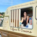Elley Grace serves Sussex Ice Cream Company flavours in cones and tubs at Coffees and Creams. Picture: Elaine Hammond / Sussex World