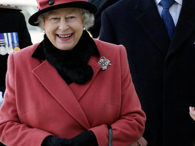 Queen Elizabeth II (L) and Prince Phillip visit the Thomas Bennett Community College in Crawley AFP PHOTO/Gareth Fuller/WPA ROTA