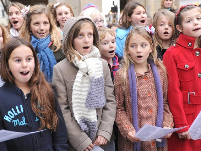 Oakwood School pupils singing carols and Christmas songs at the Cross in 2011