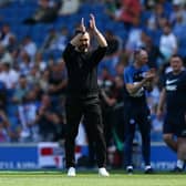 Roberto De Zerbi, Manager of Brighton & Hove Albion, applauds the fans during the warm up prior to the Premier League against Manchester United at American Express Community Stadium