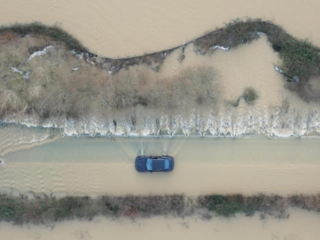 Members of the public helped drivers stuck in the flood water on the route from Billingshurst to Wisborough Green on Friday, January 5