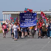 Striking NEU members and supporters marched along the prom in Worthing