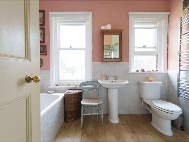 The second bathroom on the first floor, with bath and corner shower