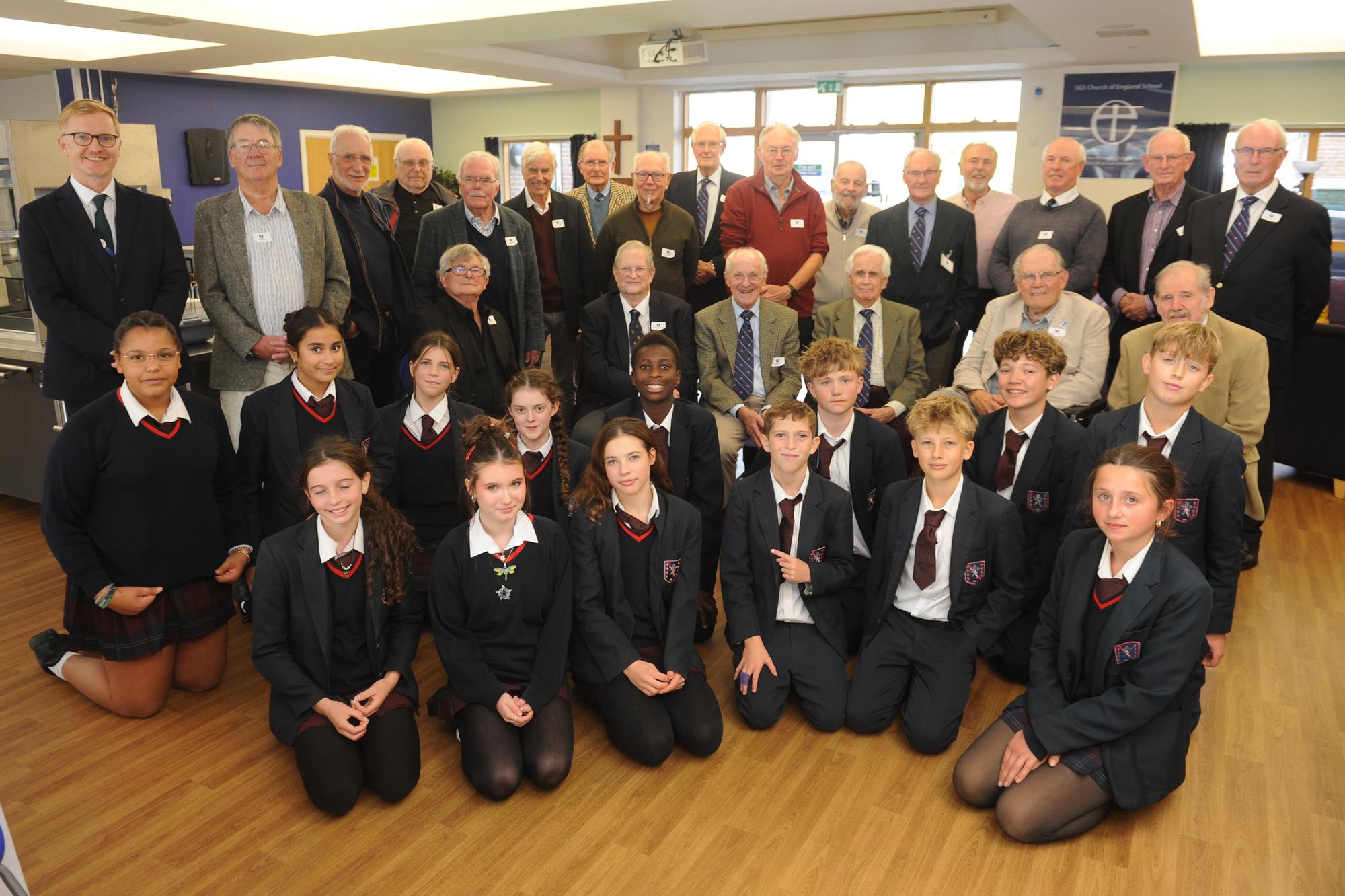 Headteacher Aidan Timmons, left, with Steyning Grammarians and current year-nine students in the boarding house