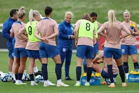 Sarina Wiegman, Head Coach of England, speaks to the players during a drinks break during an England Training Session at St Georges Park (Photo by Michael Regan/Getty Images)