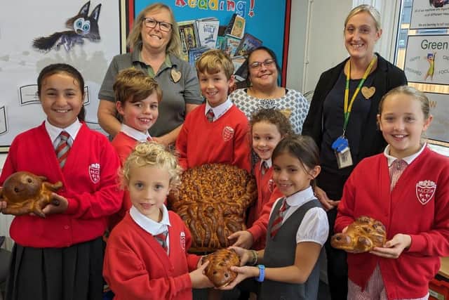 Community champion Alison Whitburn, manger Lisa Brockhurst and team leader Lynsey Porter from Morrisons Littlehampton deliver harvest loaves to Arundel Church of England School. Picture submitted.