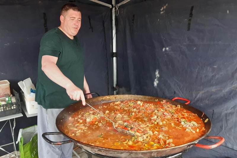 Glenn Slark cooking up seafood paella for the crowds