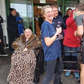 Blind Veterans UK Senior Health Care worker Lynn Allen and her husband Chris are welcomed by staff and residents at the Rustington Centre of Wellbeing after running 23 miles from Peacehaven via Ovingdean to Rustington.
