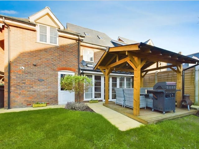 The south-facing rear garden provides the perfect retreat at the end of a long day