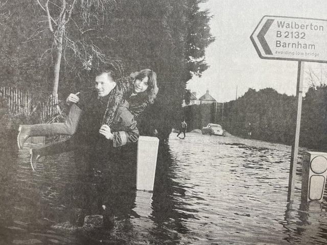 'Gallant' Philip Fogden gives Debbie Lawrence a lift through the water at North End Road, near Barnham.