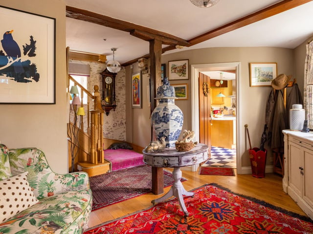 "Step foot into the entrance hallway dressed in Nina Campbell luxury designer wallpaper, sense the warmth of welcome in this utterly unique home, with its intriguing angles and curves. From the entrance hall, make your way up the staircase, carpeted in a regal Indian wool and silk mix."