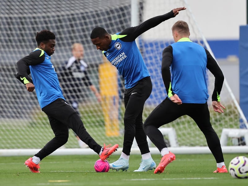 Former Chelsea man Tariq Lamptey tackles Pervis Estupinan in training