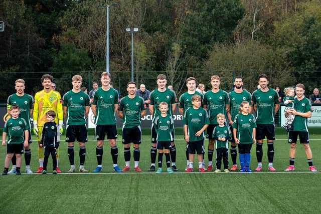 Burgess Hill Town line up with their mascots for a recent game | Picture by Lynden Humphrey