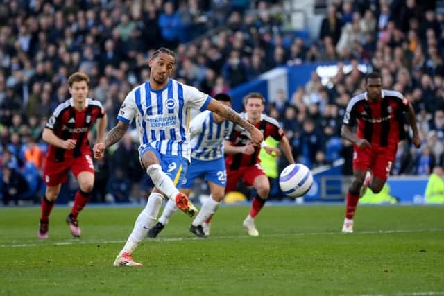 Joao Pedro of Brighton & Hove Albion scores from the penalty spot against Fulham